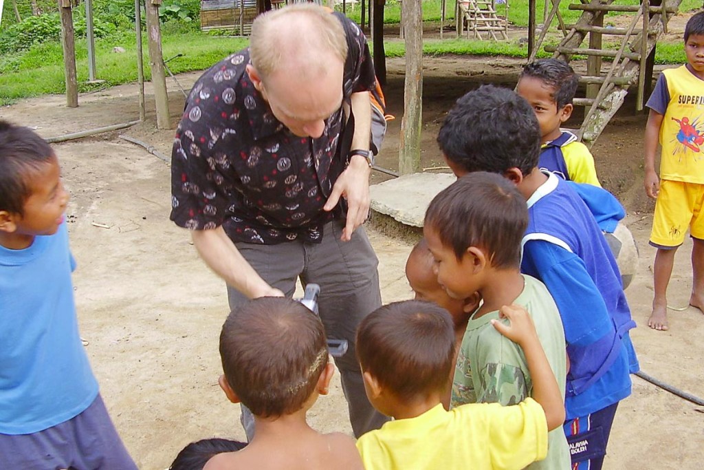 Showing off my video camera to the Orang Asli children.