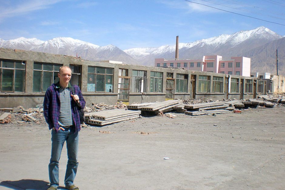 At Da Qaidam Bus Station, snowy mountains towering behind me.