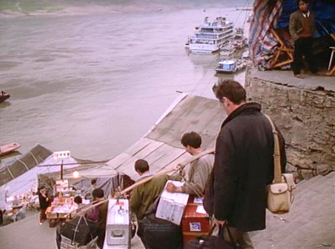 Michael Palin follows porters back down to his Yangtze boat in Wushan, China.