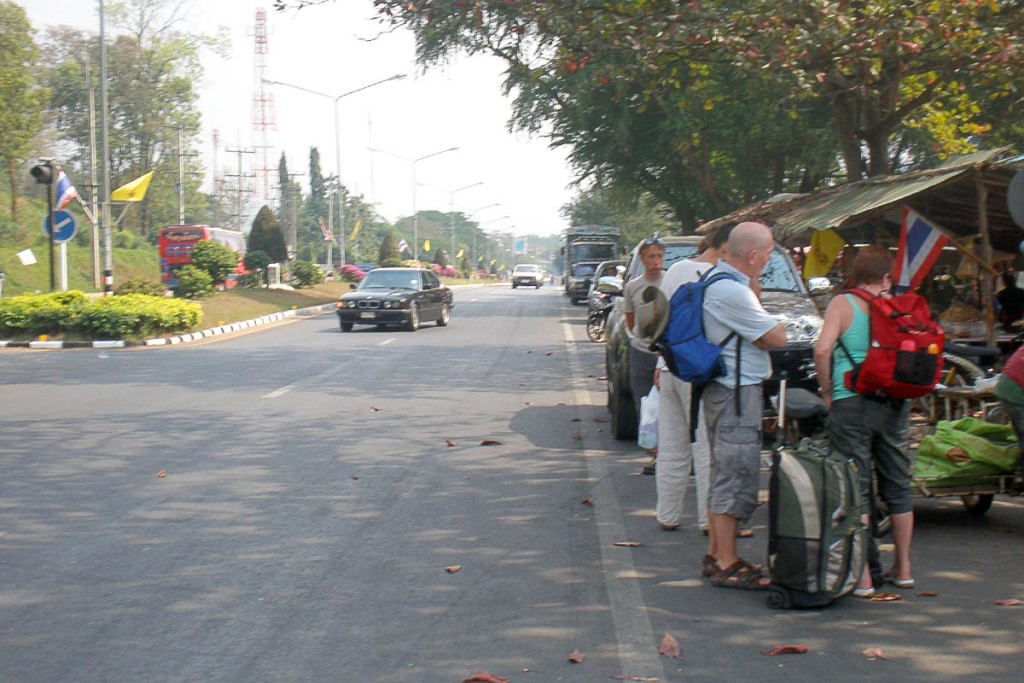 tourists-waiting-for-nam-tok-bus-thailand-road