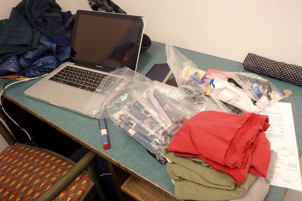 Diabetic traveler's hotel room desk.