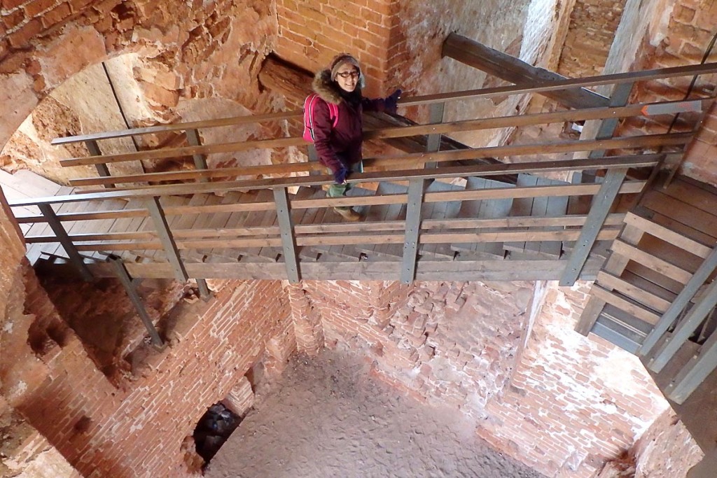 Masayo on a scary wooden walkway, at least thirty feet over the ground.