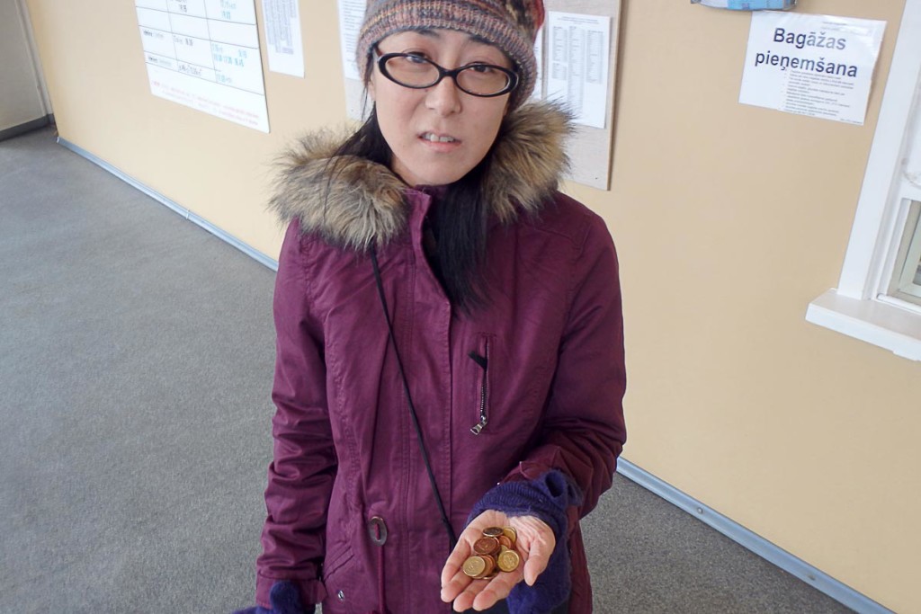 Masayo with a pile of unwanted Euro cent coins.