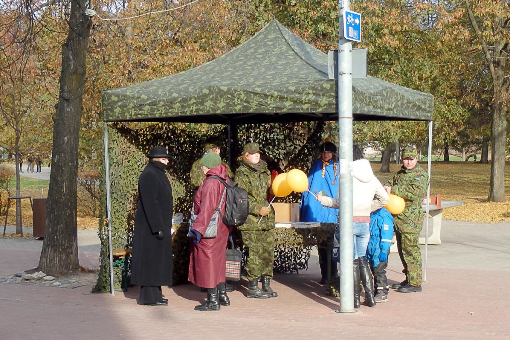 Soldiers handing out balloons. Or something.