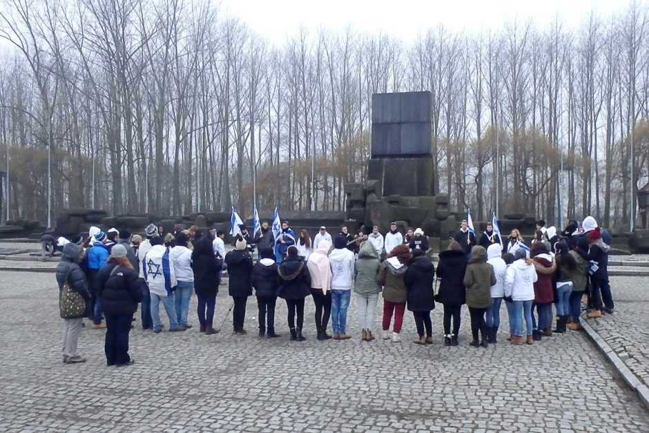 A gathering in front of the International Monument at Birkenau.