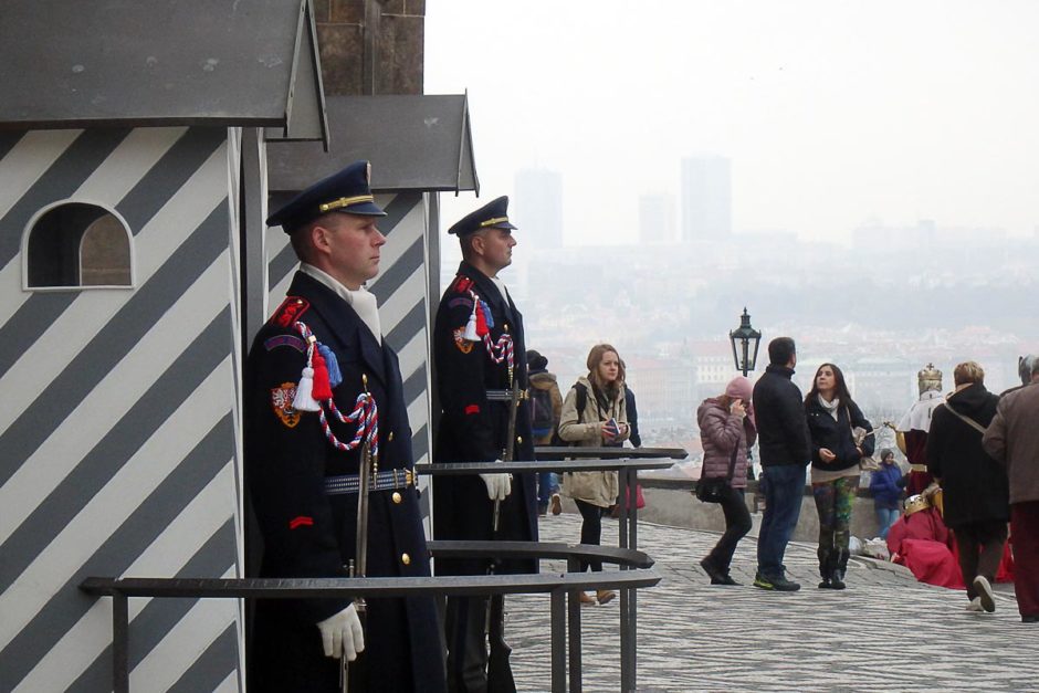 Two guards in front of Prague Castle, with the valley behind them.