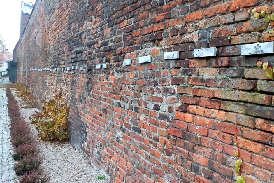 Fingerprints in concrete, along a wall in Gdańsk, marking one of the first acts of World War II.