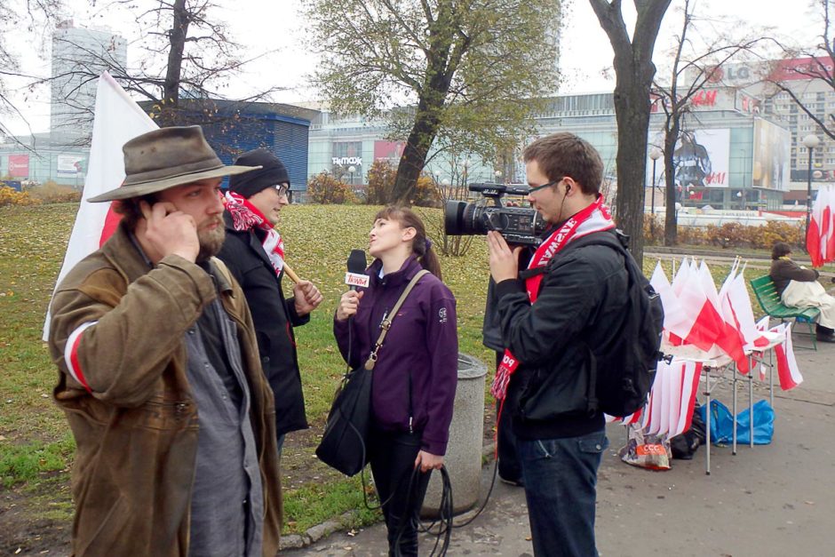 TV crew doing a man on the street interview.
