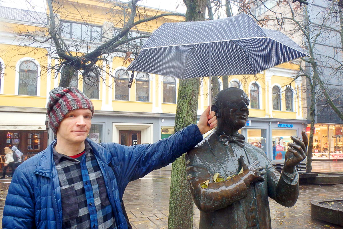 Me and a statue with an umbrella in Kaunas