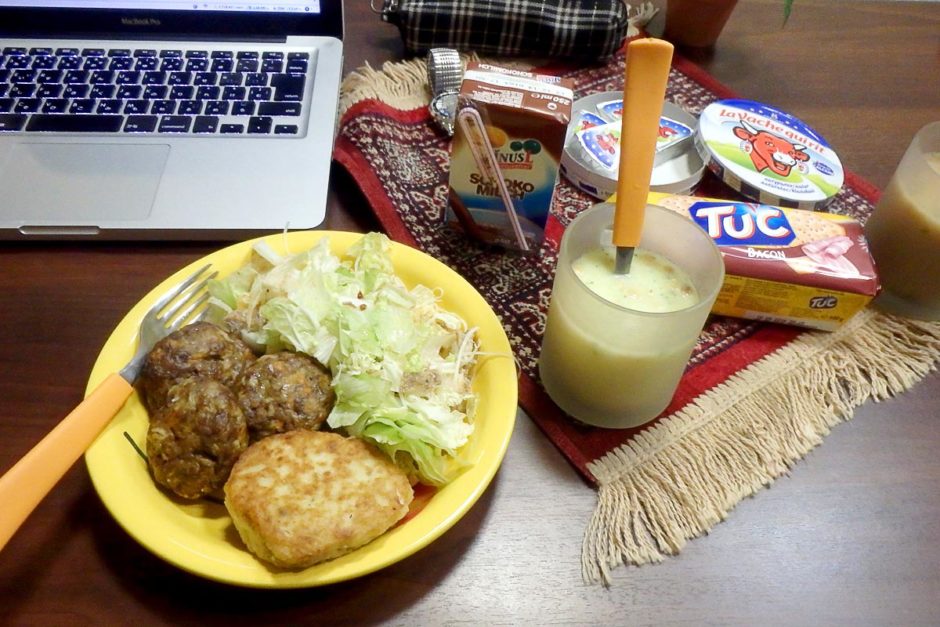 Meatballs, crackers and cheese, a fishcake, salad, and chocolate milk. No dessert.