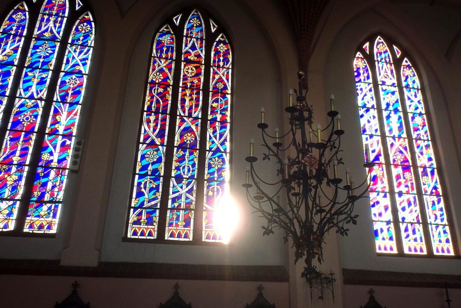 Stained glass windows with the sun coming in inside St. Anne's.