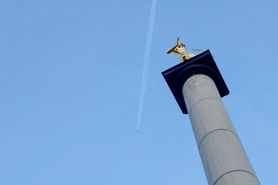 The archer sundial, with a jet flying overhead.