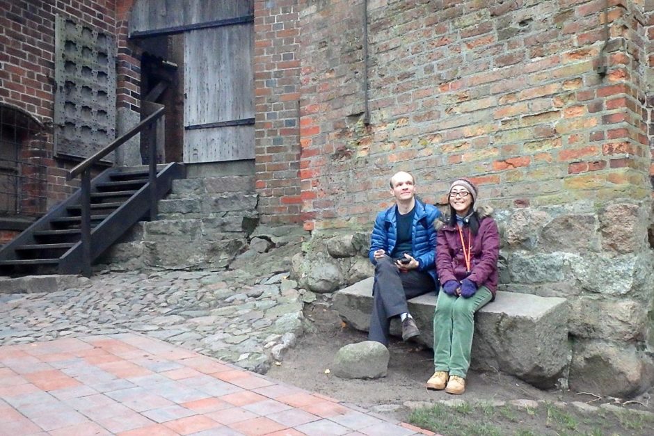 Me and Masayo in a courtyard within the Malbork Castle grounds.