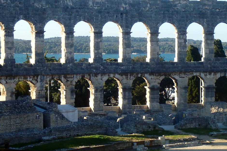 The Adriatic Sea visible through the amphitheater's windows.
