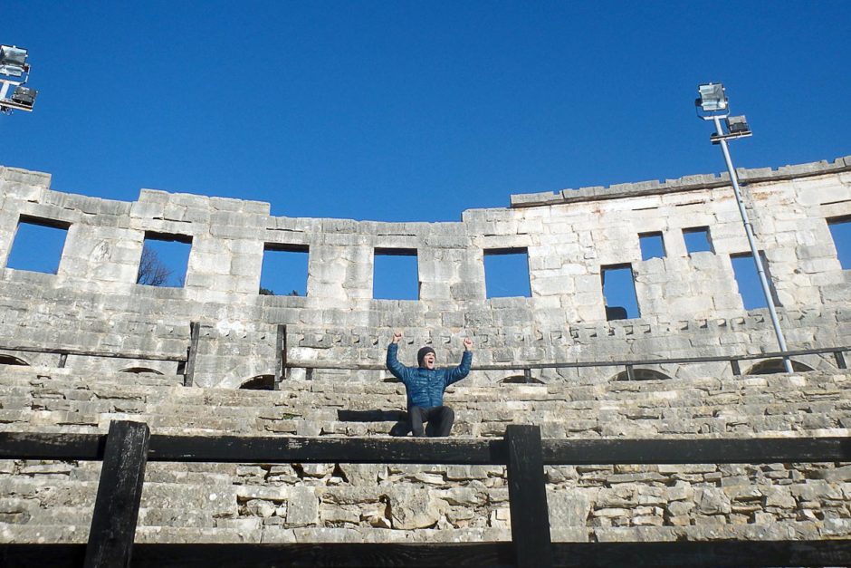 Cheering the imaginary show in the amphitheater, as the ancient Romans musta.