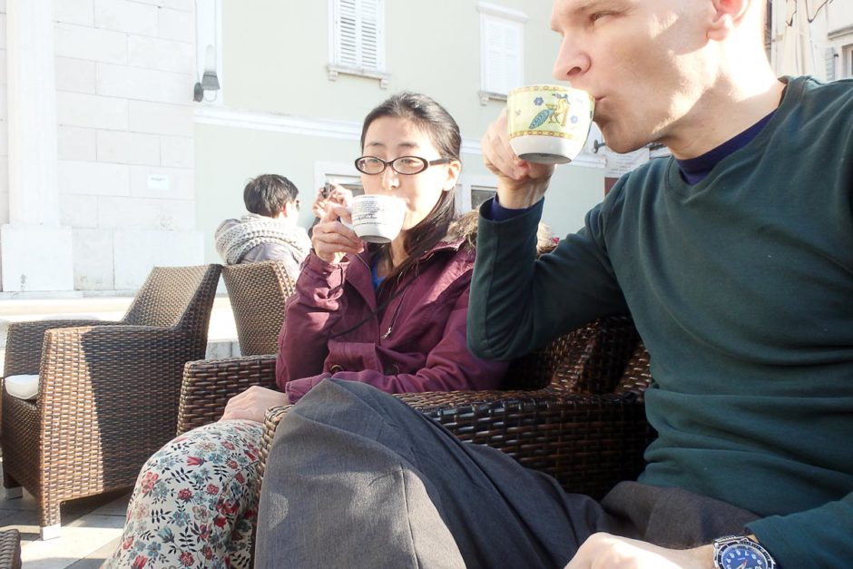 Coffee break outside in the sunny town square of Piran.