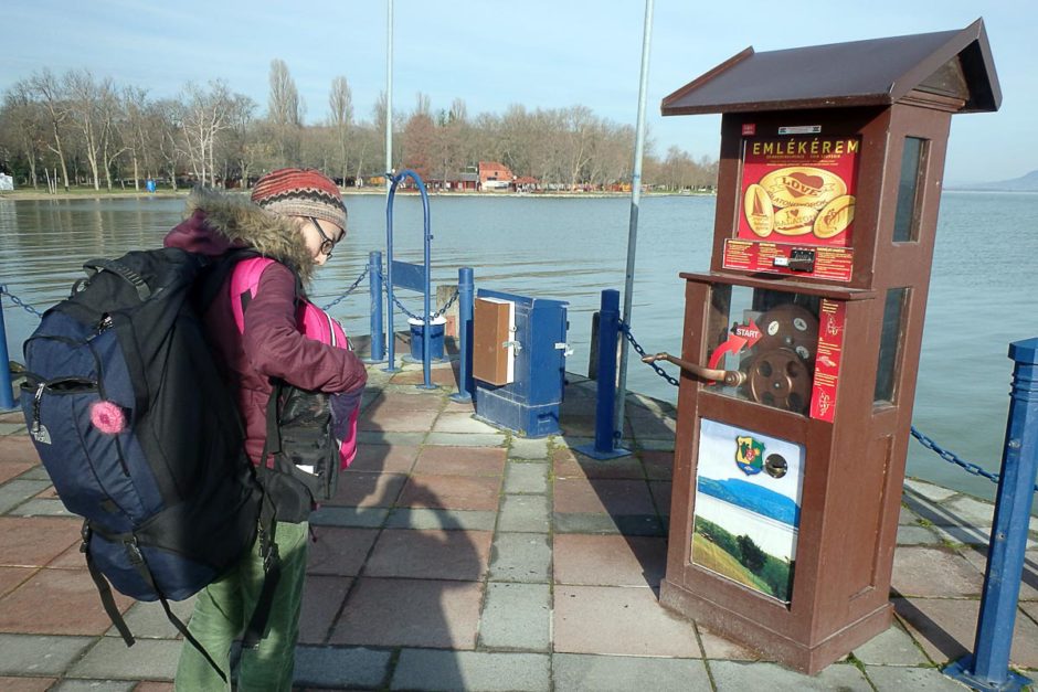 Masayo and the souvenir coin machine on the Lake Balaton pier.