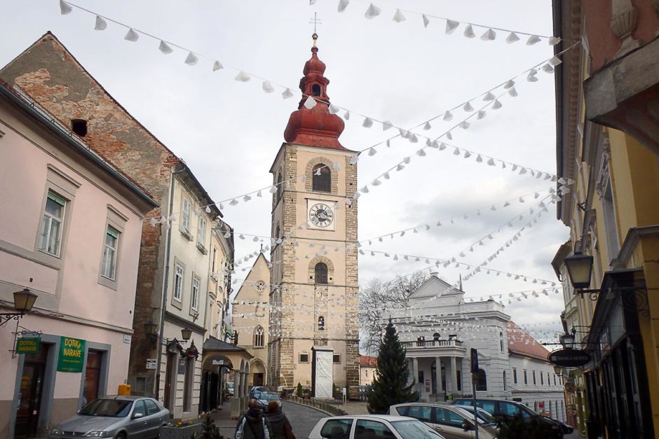 The main clock tower in Ptuj, with Christmas decorations everywhere.