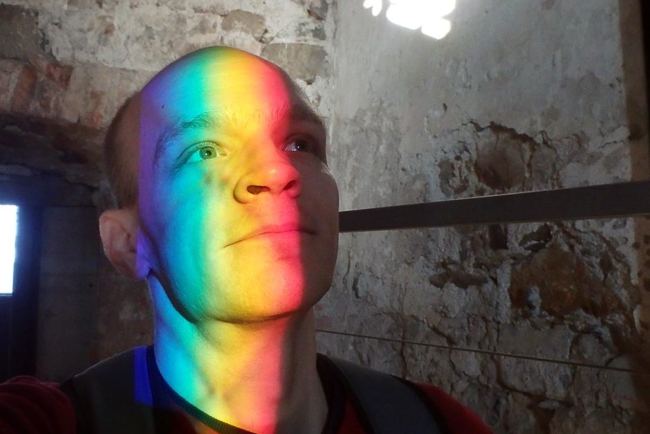 The sun was shining through a window and prisming into a rainbow.