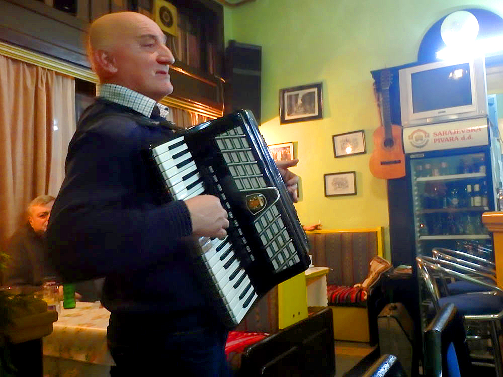 Accordion player in Sarajevo restaurant. Not employed to be there for the diners; he was one of the diners. Very nice evening.