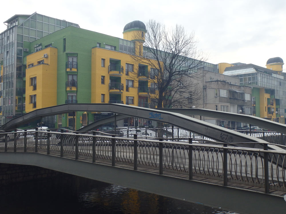 Colorful buildings and a bridge over the river in Sarejevo