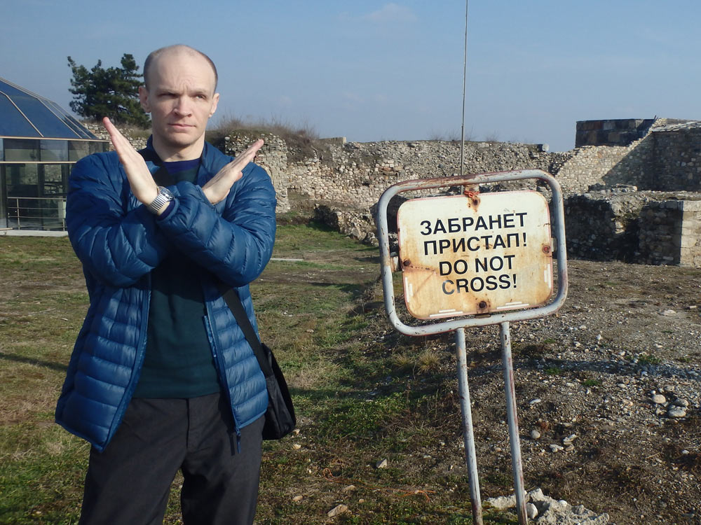 "Do Not Cross" sign at Kale Fortress, with guy crossing anyway