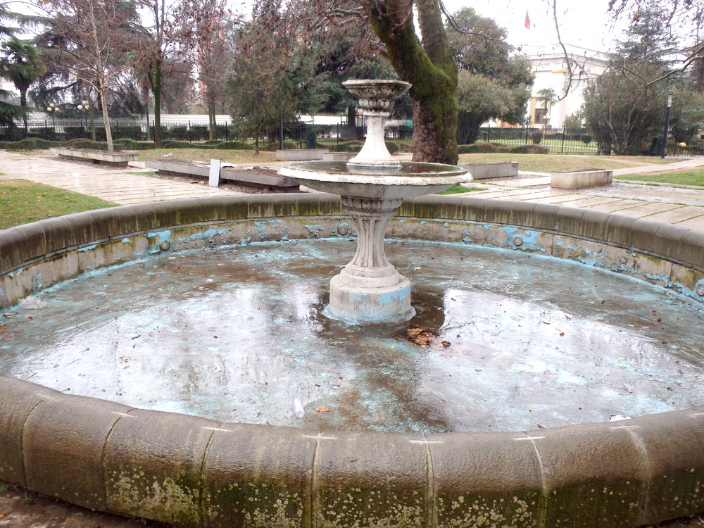 Empty Tirana fountain in the rain