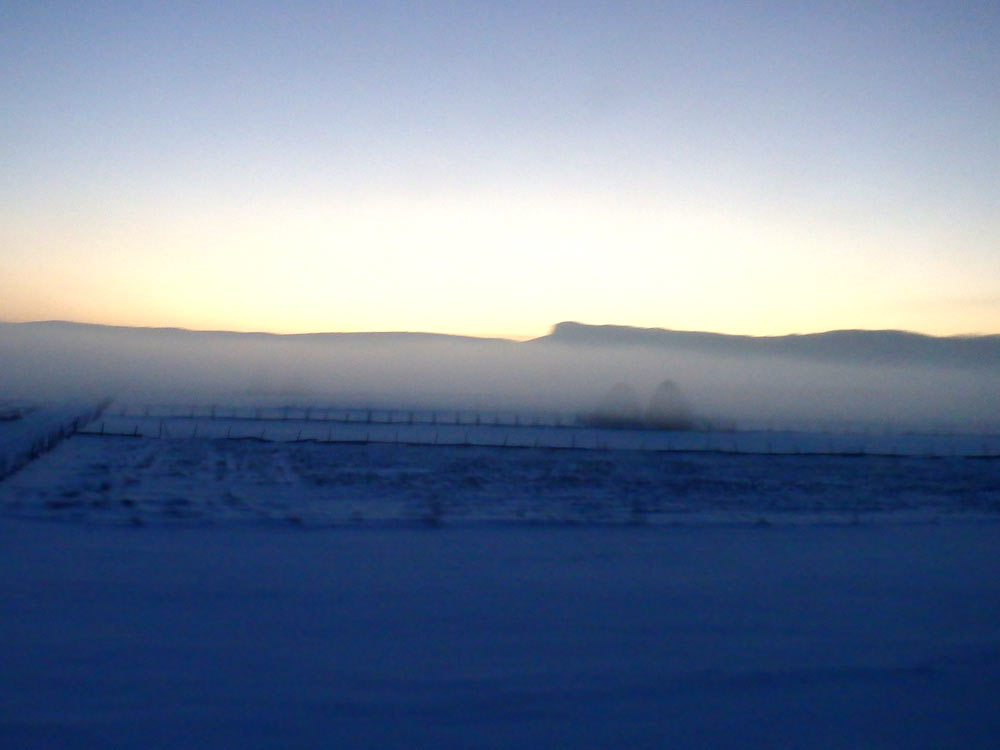 One of the most striking images for me was this fog that hung over the ground — but not directly on it — at sunset.