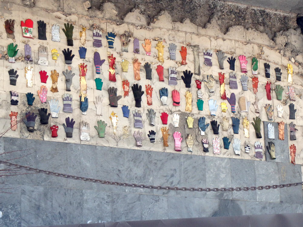 Gloves and mittens on the outside wall of the history museum of Sarajevo. There was no explanation, but just under them (just out of frame) was a Nazi airplane with no wings.
