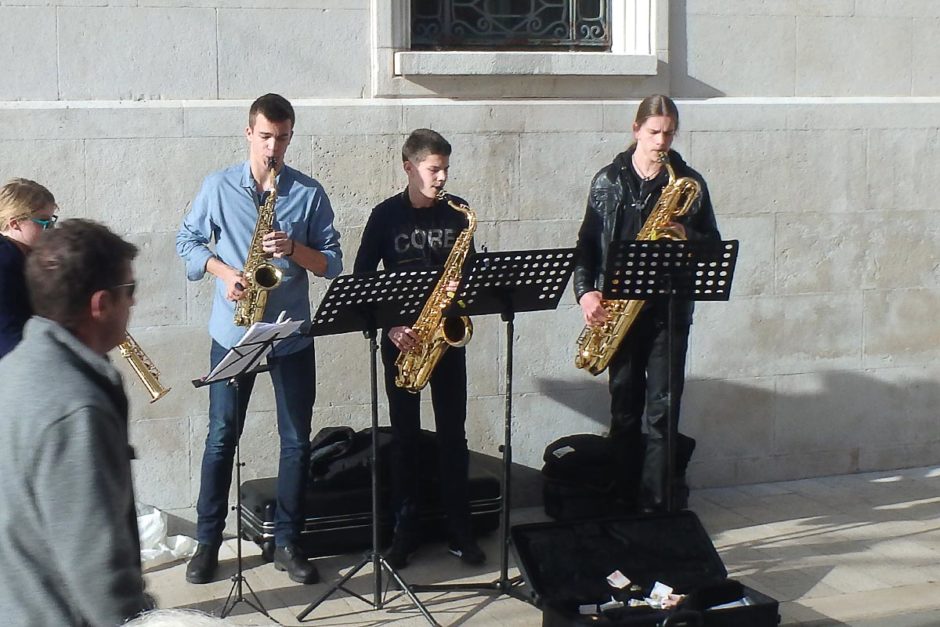 A group playing saxophones and stuff on a pedestrian street in Split.