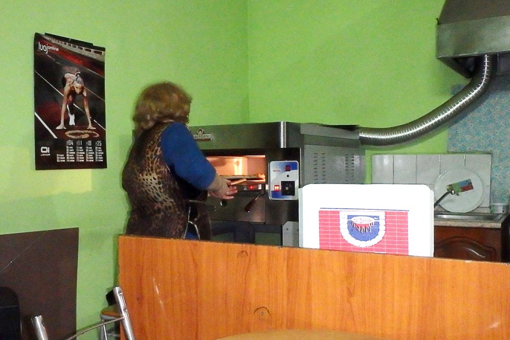 Woman making our pizza in Tirana.