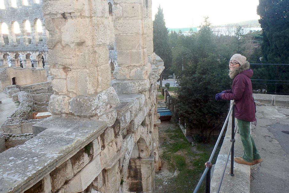 Masayo gazes at the Pula amphitheater in the warmish New Year afternoon.