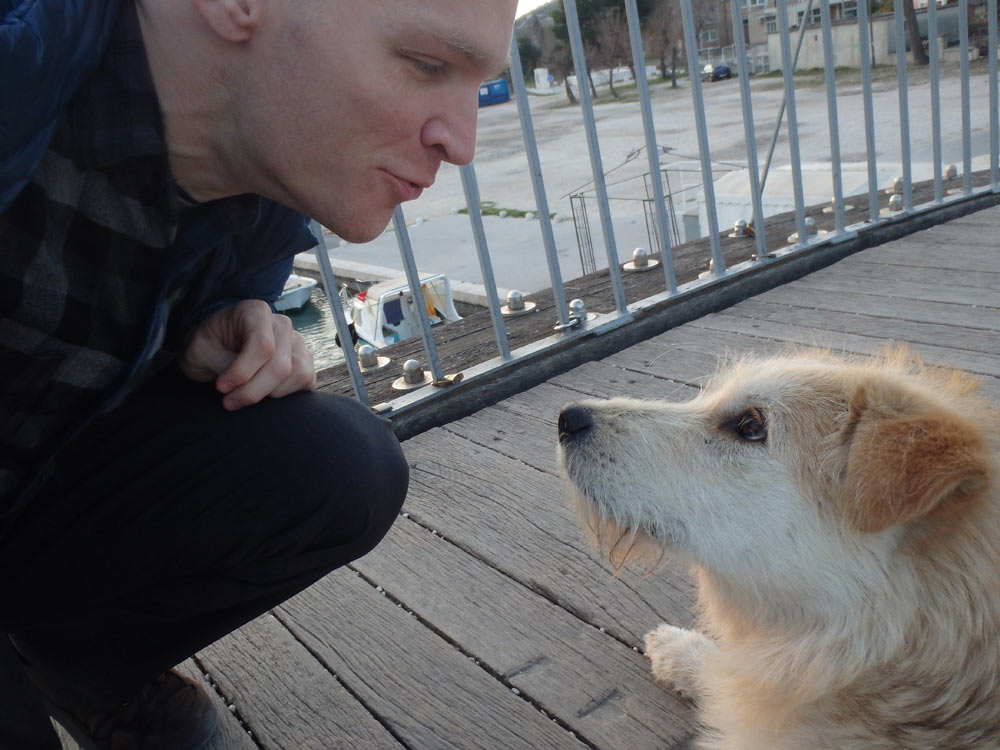 Meeting my new dog friend on a small pedestrian bridge in Trogir.