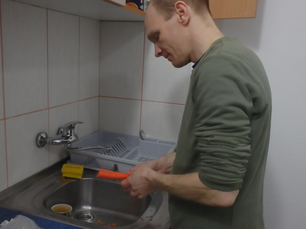 Whittling a carrot into a dinner.