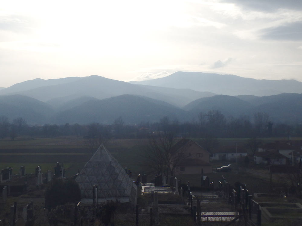 Mountain scenery between Kraljevo and Ušće. The pyramid in the foreground is in a cemetery.
