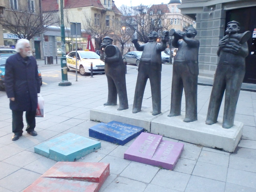 Musician statues, watched by an old man passing by. The colored tiles were all around Skopje, and as far as I could tell commemorated the 1963 earthquake that destroyed the city.