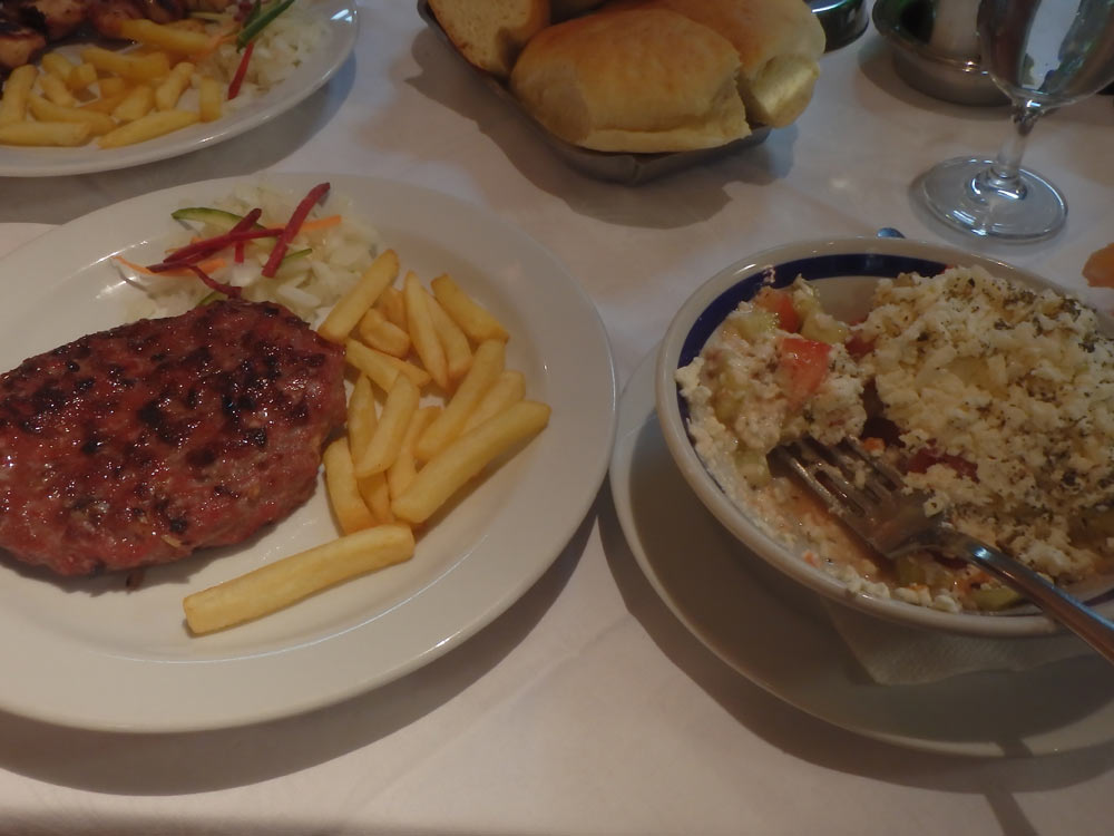 Serbian hamburger and cheese salad meal in Kraljevo