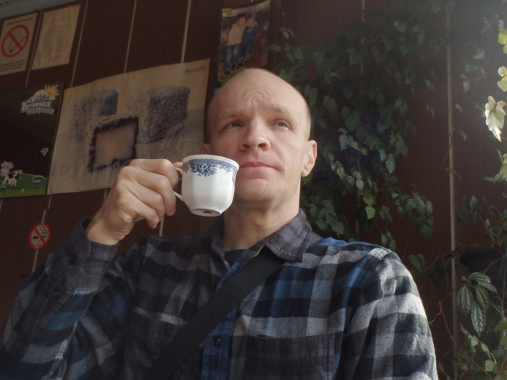 Sipping coffee in a cafe in Ušće