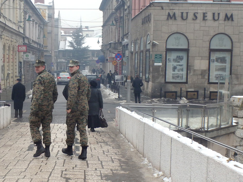 Soldiers on the Latin Bridge in Sarajevo. World War I began just past them, on the corner to the right across the street.