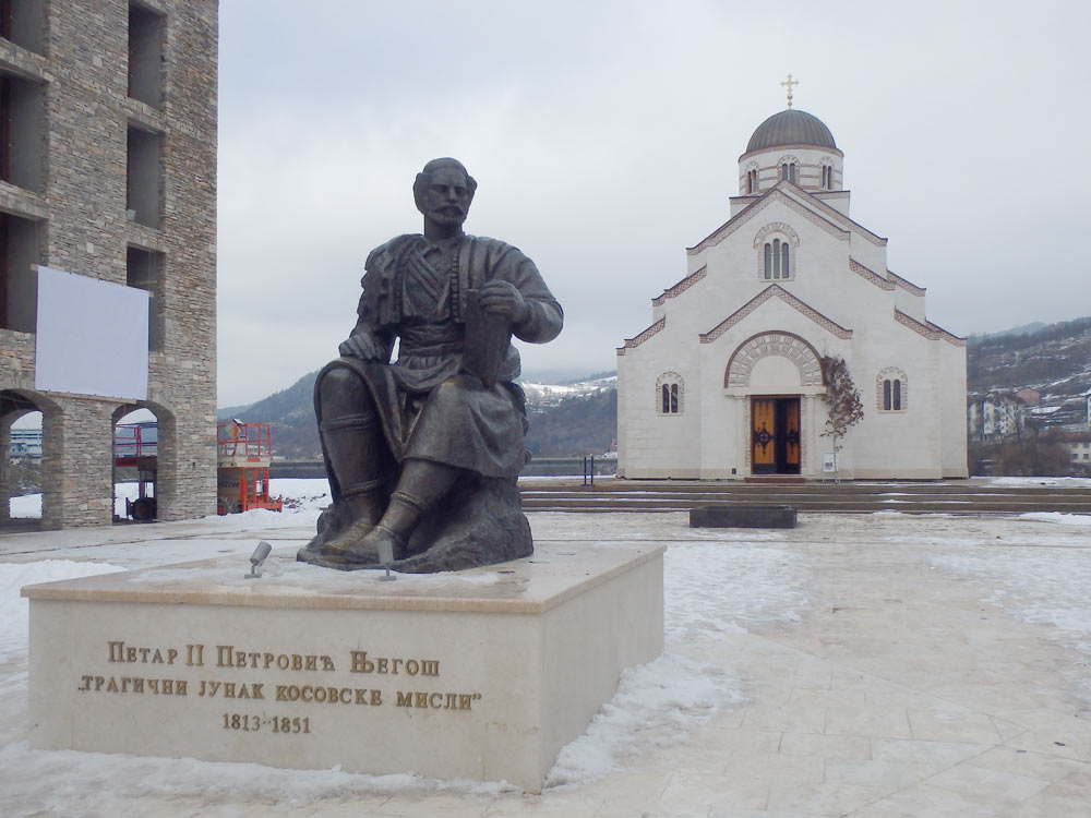 Statue and church in Andrićgrad