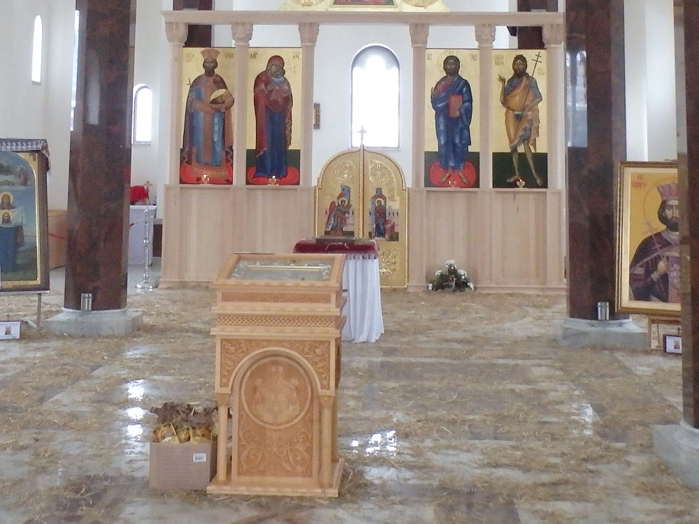 Straw-covered floor in Andrićgrad church