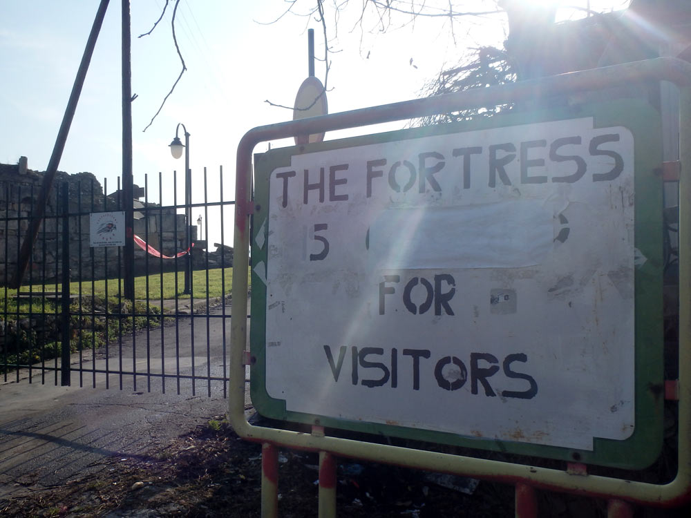 "The Fortress Is Closed For Visitors" sign, with "Closed" pasted over, at Kale Fortress