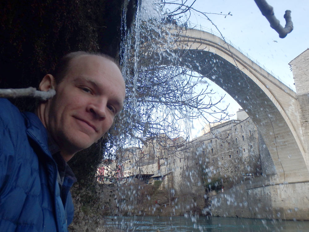 Under Mostar's Old Bridge, with some water splashing around me.