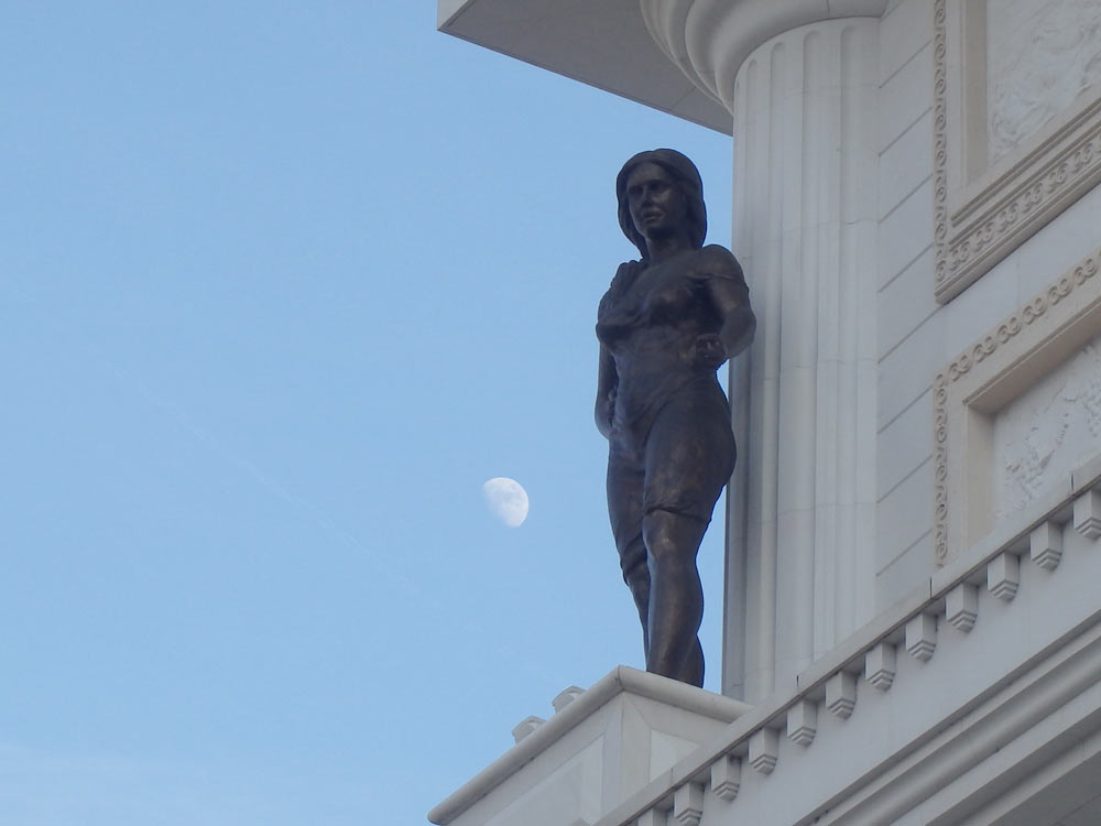 Naked woman statue and the moon at the Arc de Triomphe copy
