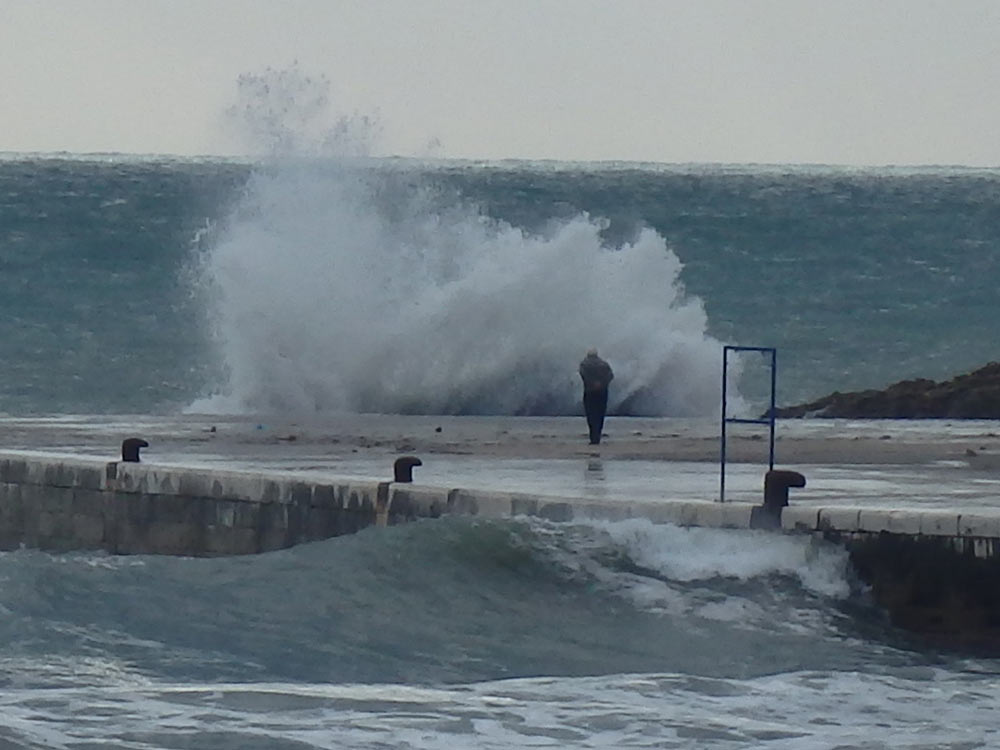 Big splash and a fearless guy watching