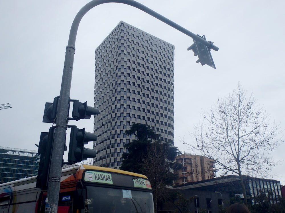 Light pole and interesting skyscraper in Tirana