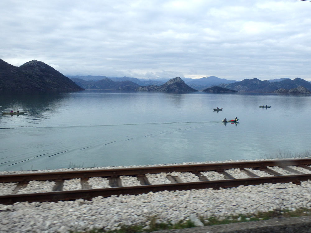 Railroad tracks and Lake Shkodra, from the bus window