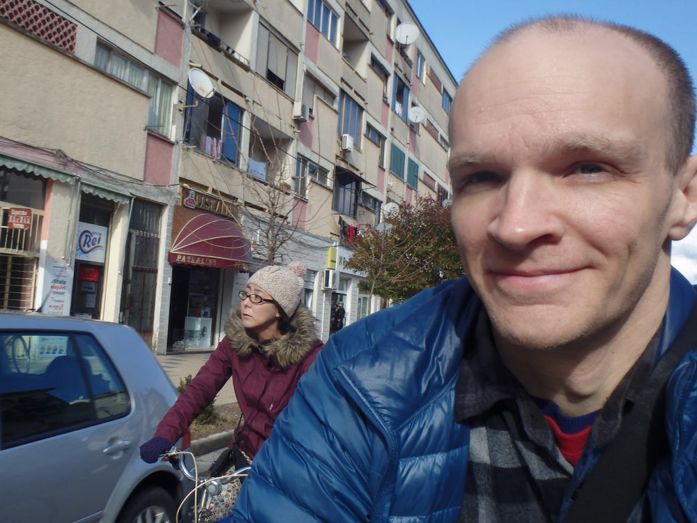 Us riding bicycles to Rozafa Castle down one of Shkodër's big streets