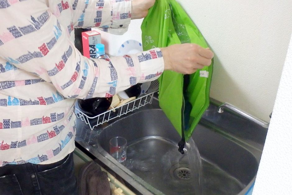 scrubba-wash-bag-pouring-water-in-sink
