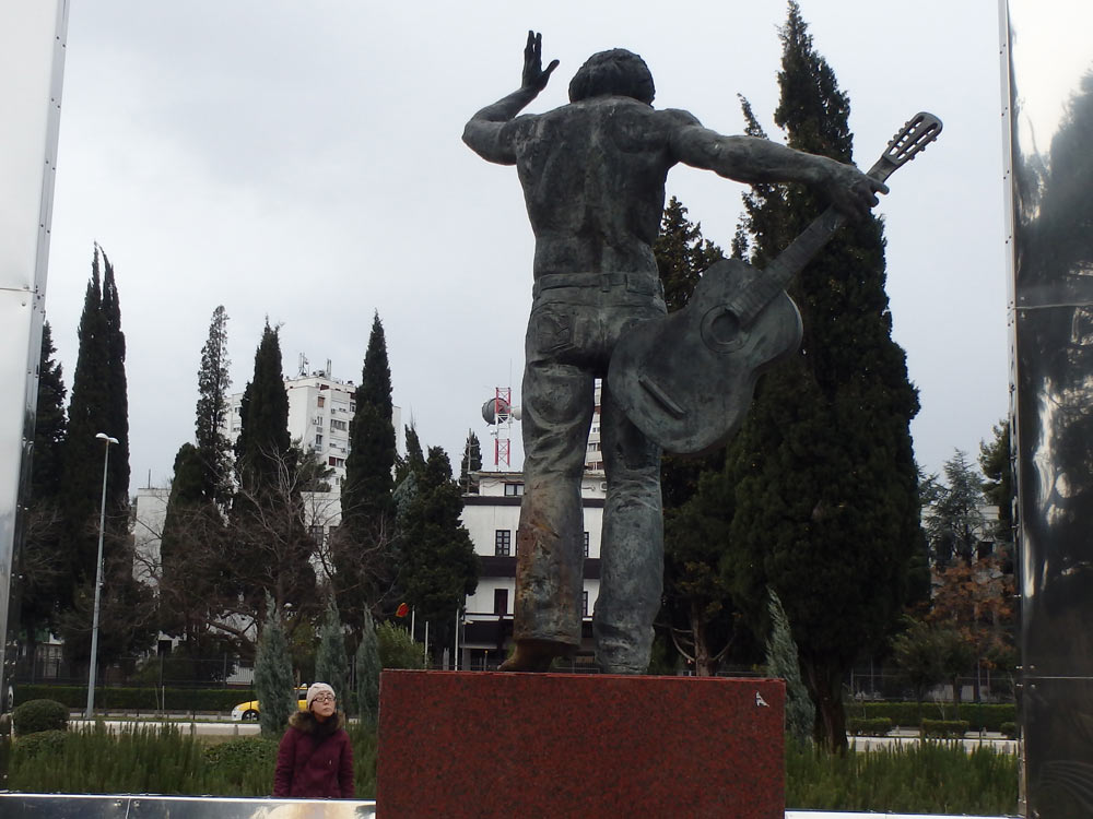 Shirtless guitar statue on the other side of the Ribnica River